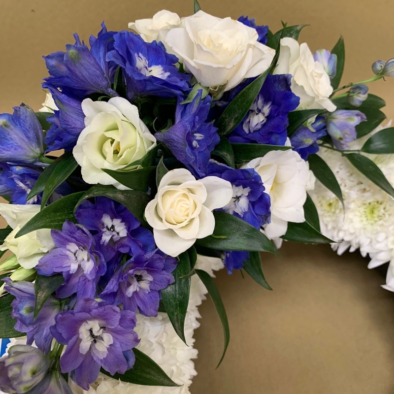 Based wreath with coloured ribbon