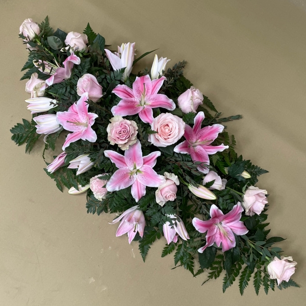Rose with lilies casket spray