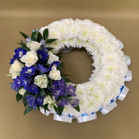 Based wreath with coloured ribbon