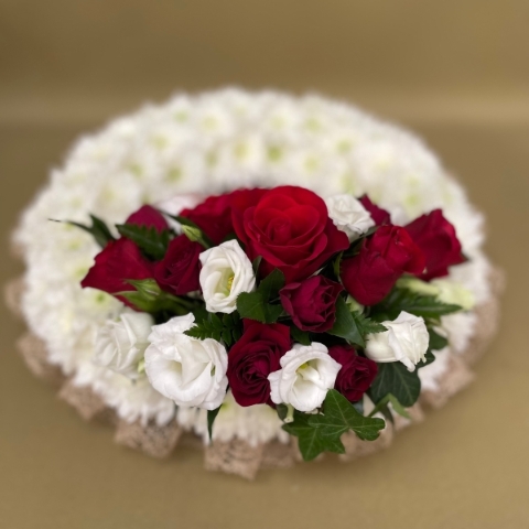 Based wreath with natural ribbon