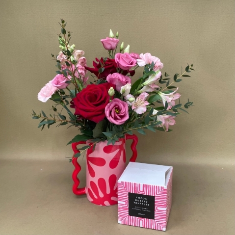 Tickle me pink vase with chocolates