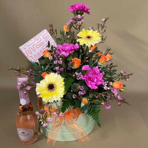 Petals, chocolates and Prosecco hatbox arrangement